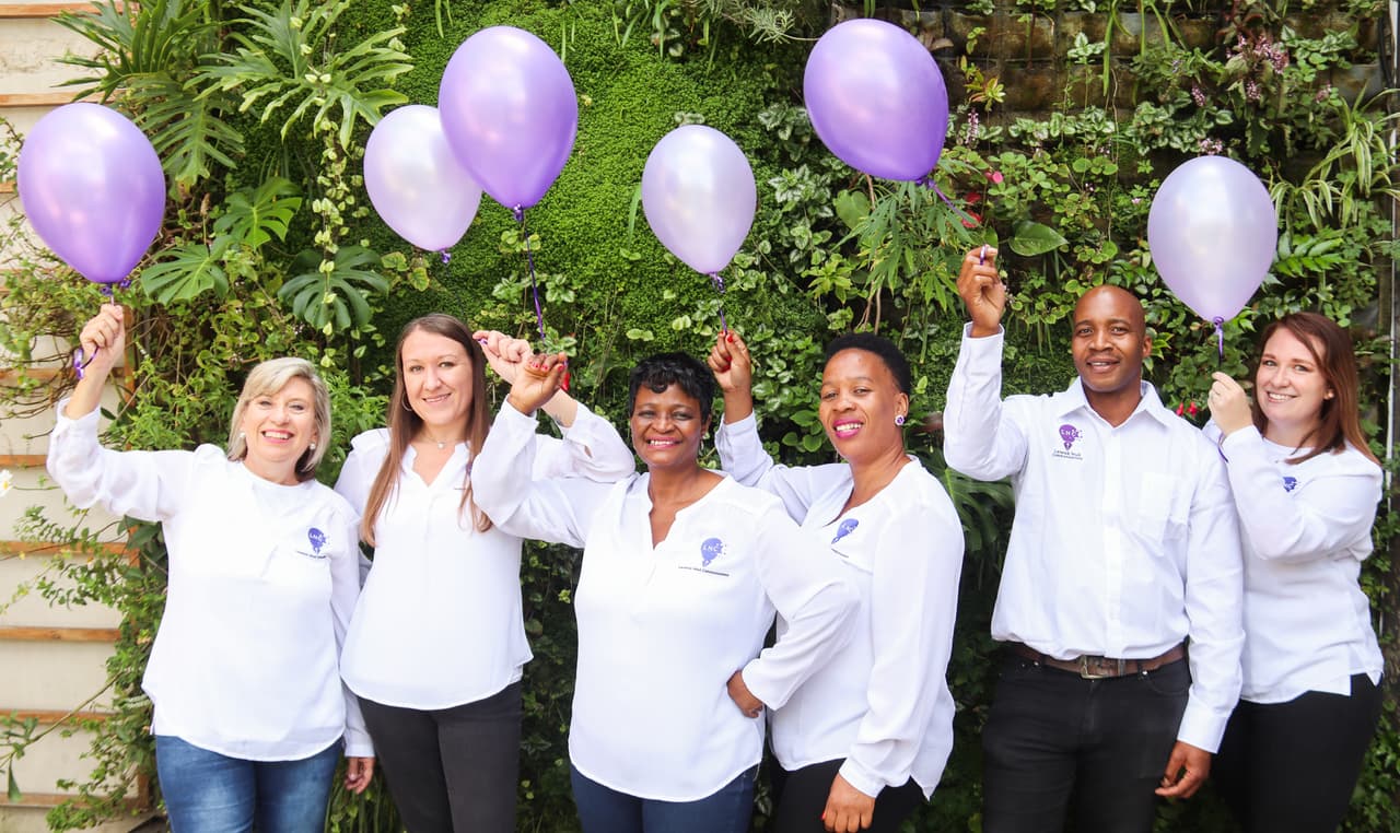 LNC team with purple balloons